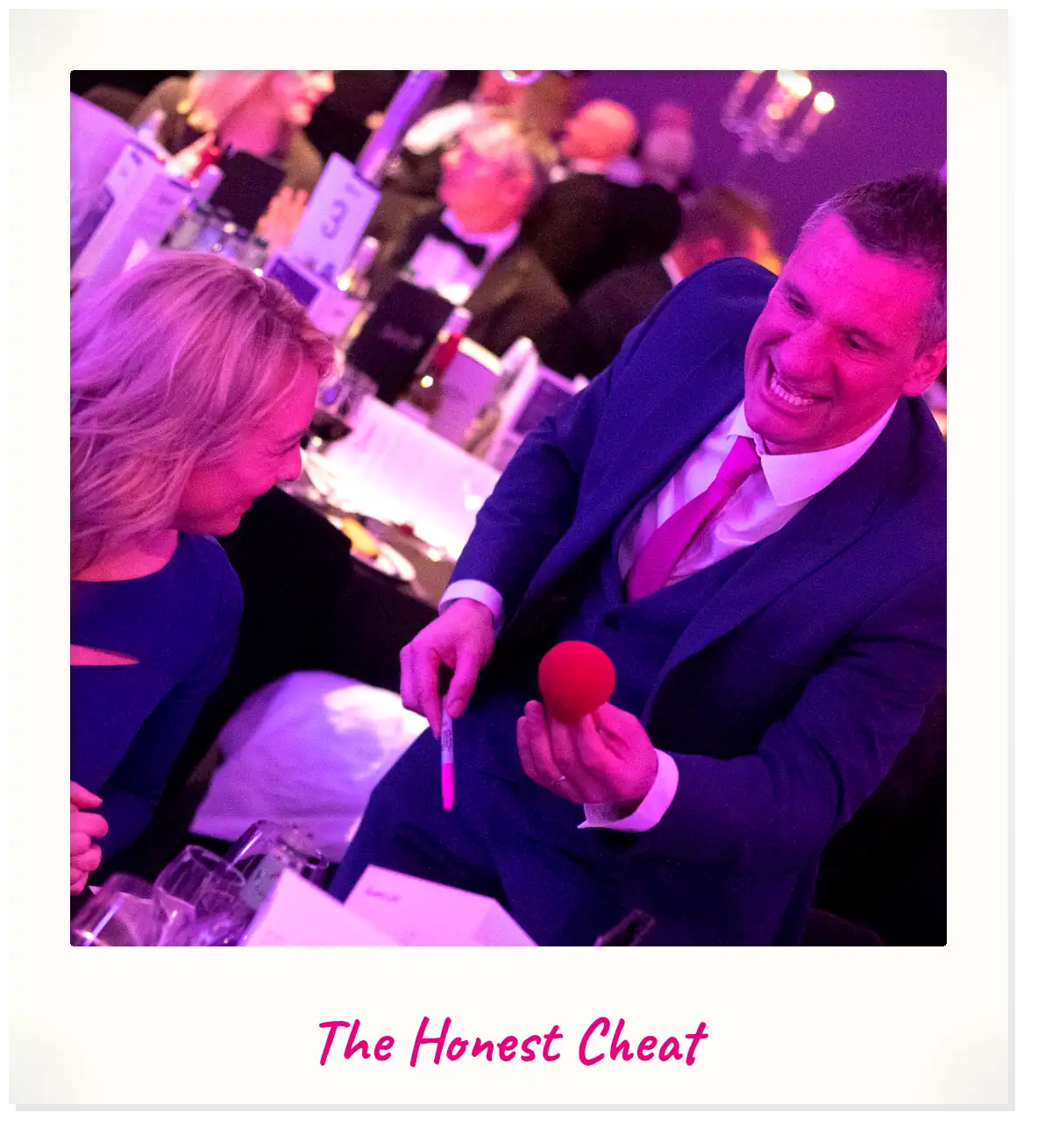 Jody Greig delivering a comedy card routine at a corporate dinner event